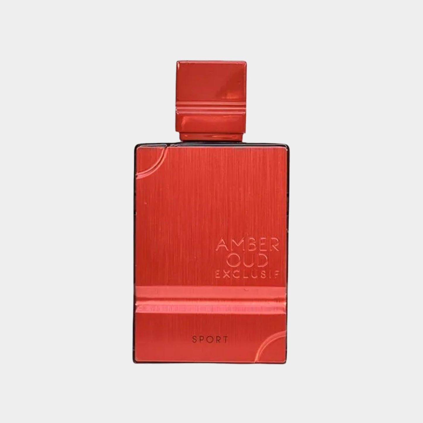 Monsterflesje van Amber Oud Exclusif Sport Cologne in een opvallende rode verpakking, ideaal voor liefhebbers van luxe geurervaringen.