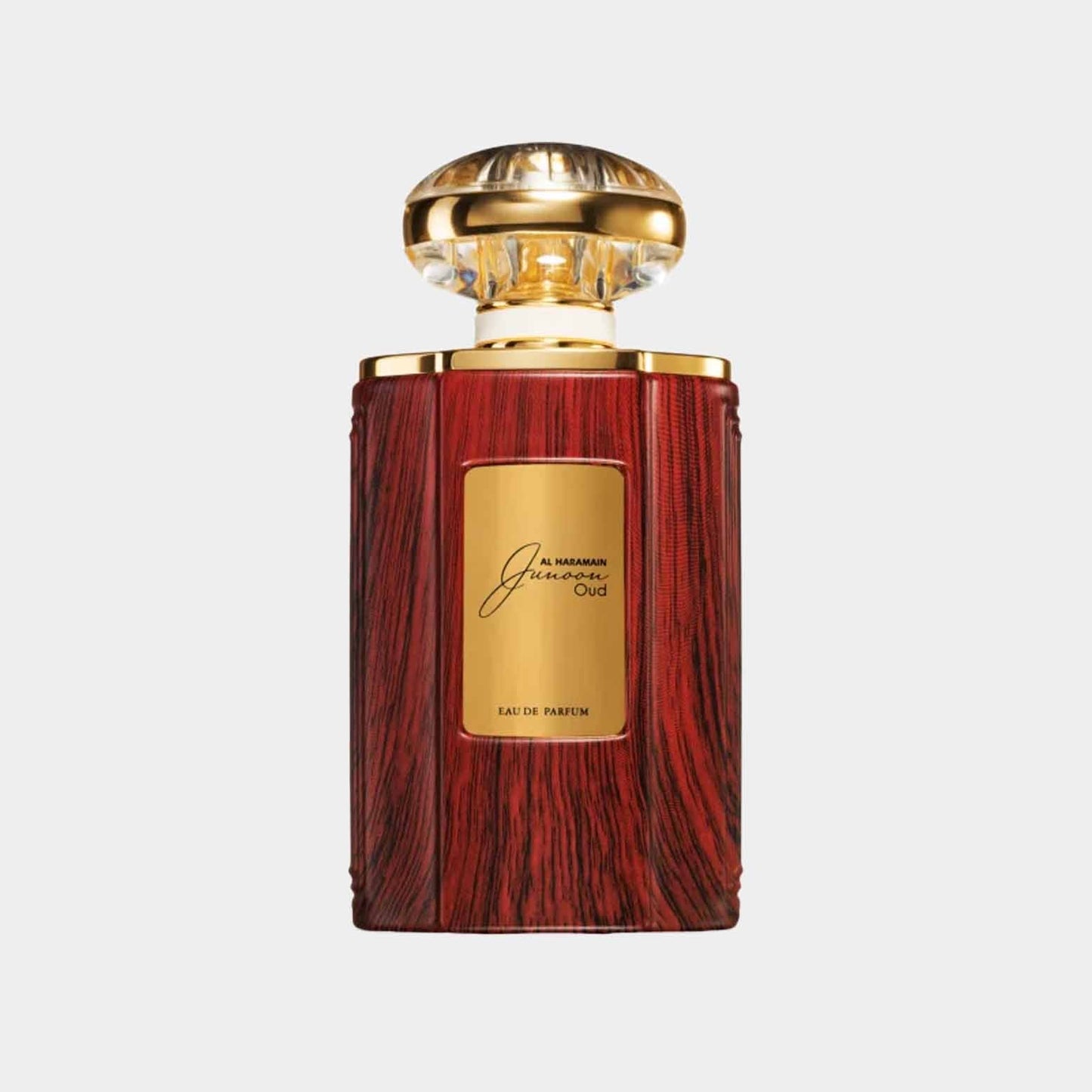 Volle fles Al Haramain Junoon Oud, verpakt in een luxe houten design met een gouden stopper, perfect voor liefhebbers van aparte parfums.