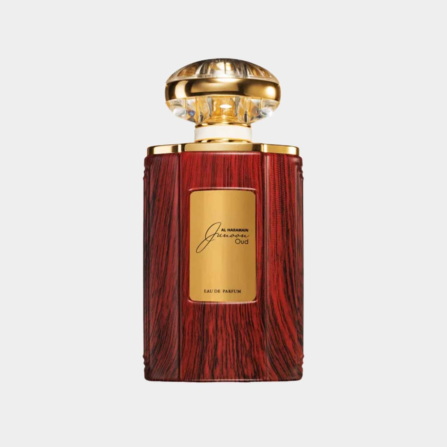 Volle fles Al Haramain Junoon Oud, verpakt in een luxe houten design met een gouden stopper, perfect voor liefhebbers van aparte parfums.