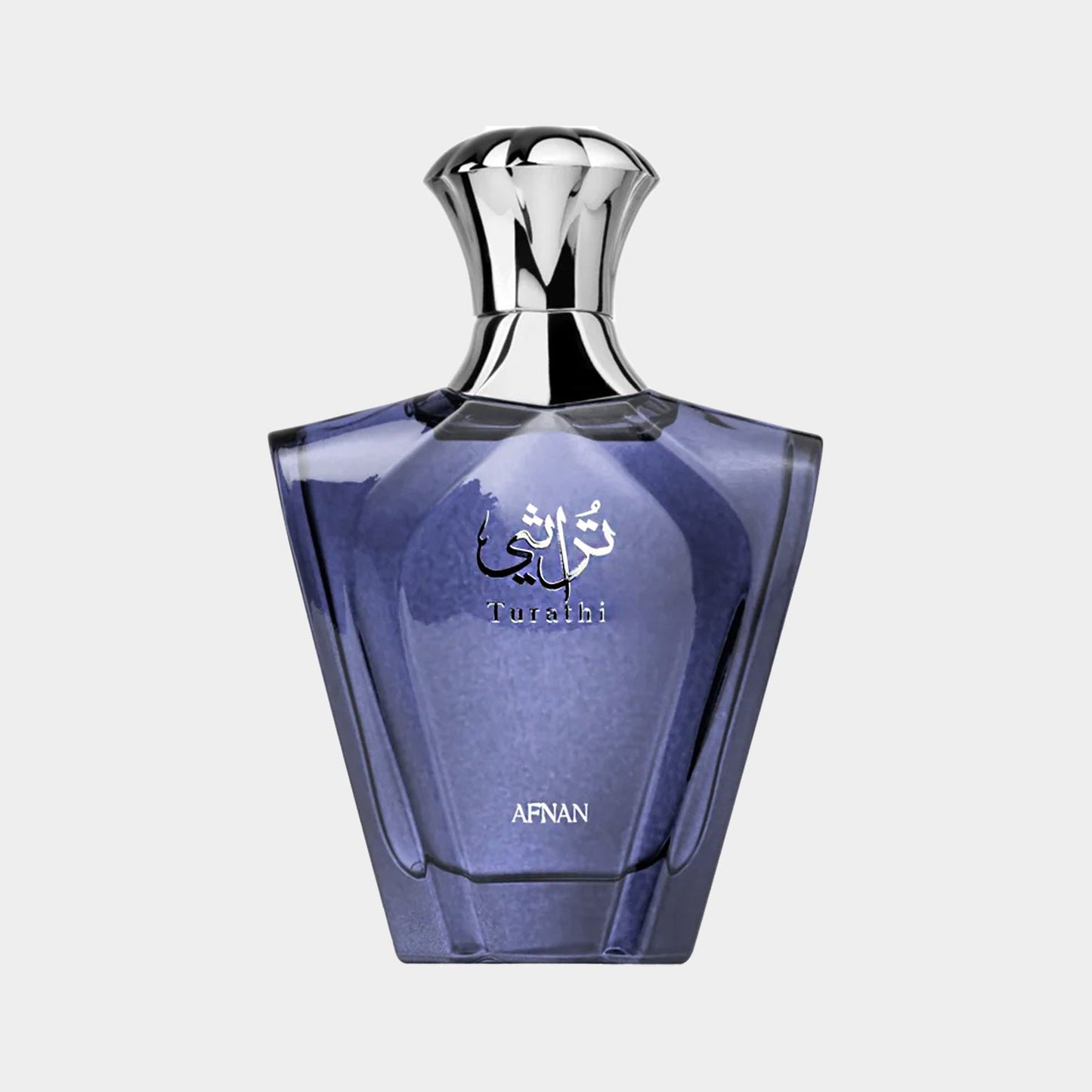 Afnan Perfumes Turathi Blue volfles met een elegante, glazen flacon in een diepe blauwe tint en een glanzende metalen dop.