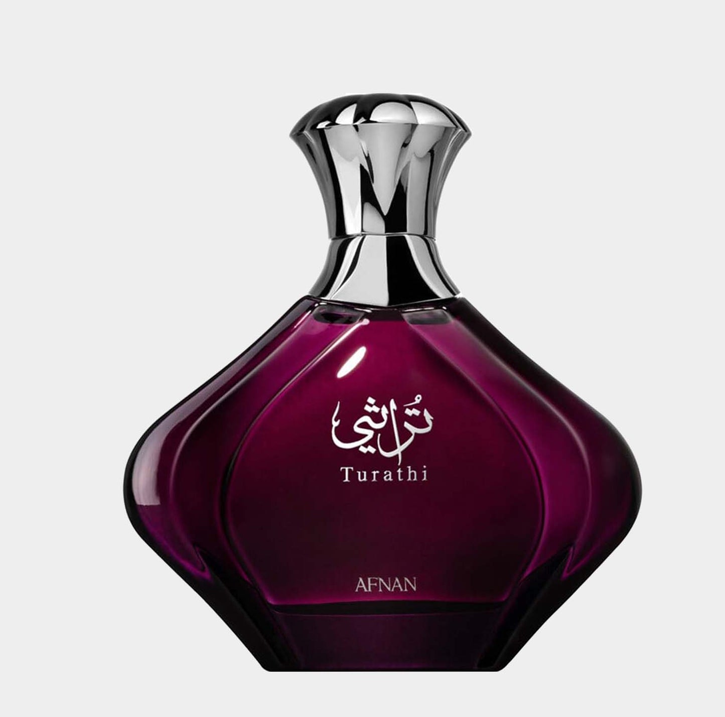 Afnan Perfumes Turathi Purple Sample, een elegant parfum in een prachtige paarse fles met een geslepen vorm en metallic dop. De verpakking straalt luxe en verfijning uit.