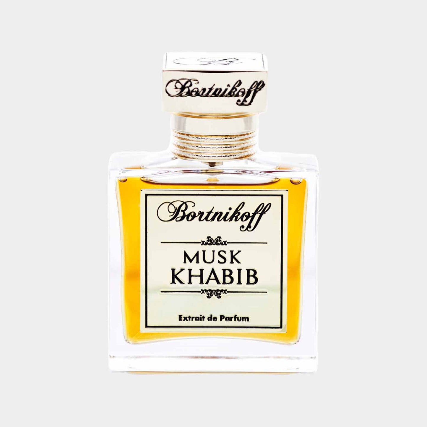 Een elegant parfumflesje van Bortnikoff met de naam Musk Khabib, gevuld met een rijke, amberkleurige geur. Dit is een sample van het luxe extrait de parfum.