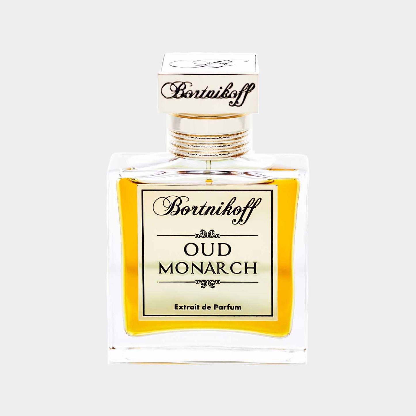 Bortnikoff Oud Monarch Sample; een elegant glazen parfumflesje met een gouden inhoud, afgewerkt met een luxe dop en een verfijnd etiket.