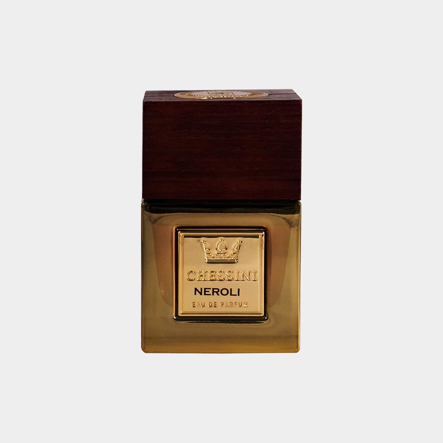 Sampel van Chessini Neroli, een luxueuze geur gepresenteerd in een elegant glazen flesje met een houten dop en een gouden label.