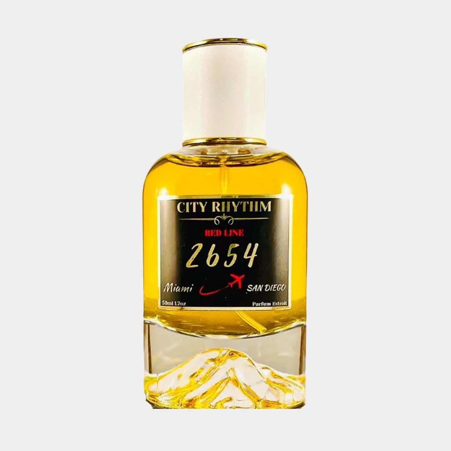 Fles van de City Rhythm 2654 Sample parfum, met een gouden inhoud en een witte dop, geïnspireerd door de steden Miami en San Diego.