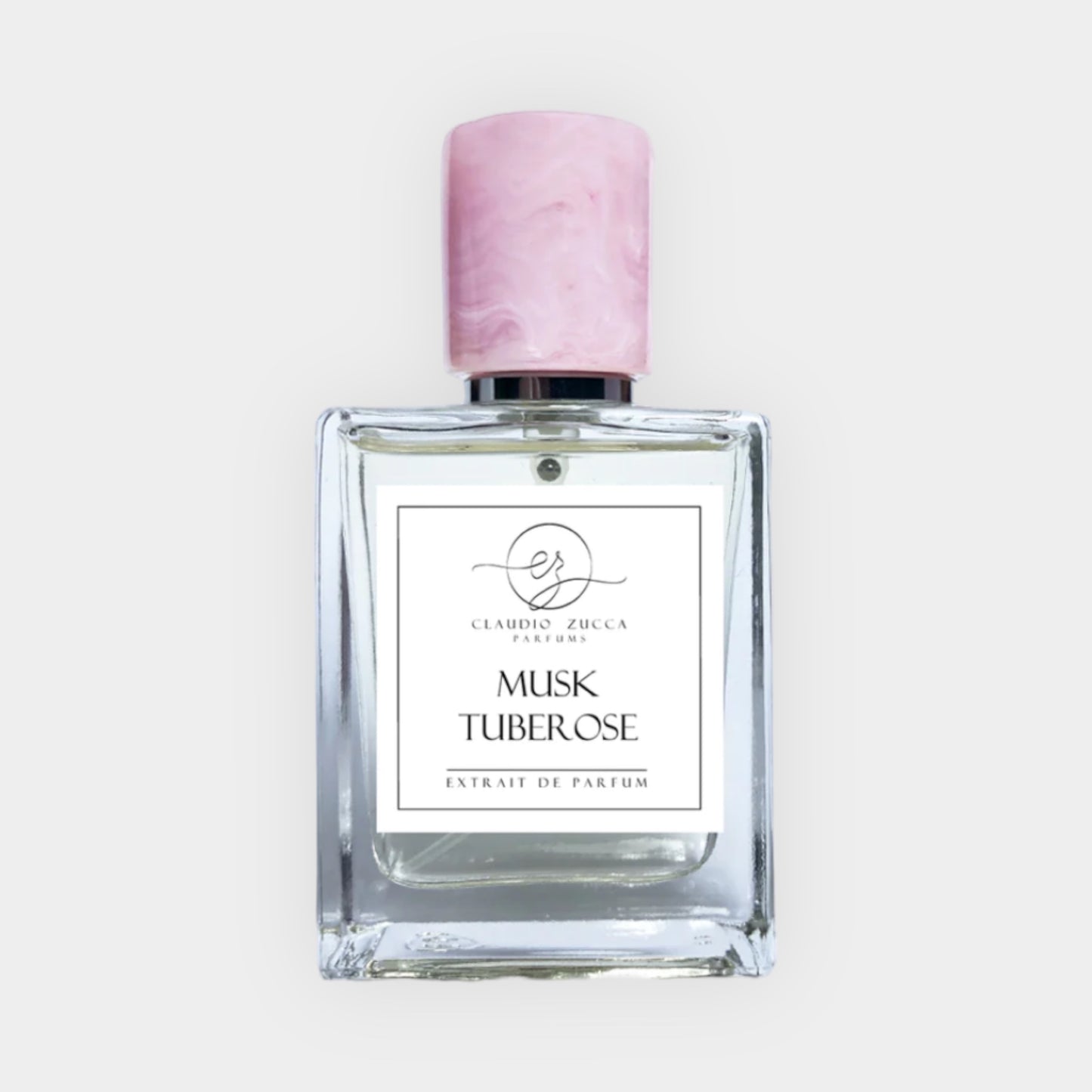 Claudio Zucca Musk Tuberose sample, een elegante parfumfles met een roze dop, met een minimalist label dat de geur van tuberoos en muskus benadrukt.