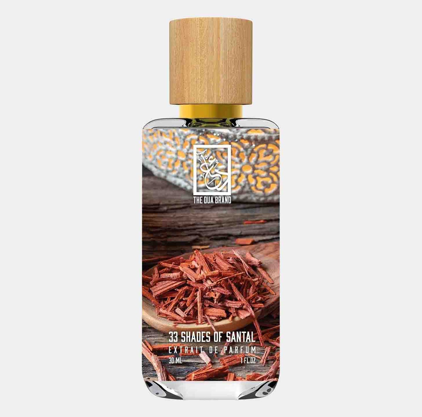 Dua 33 Shades of Santal Sample, een luxe parfum in een elegante fles van 30 ml, omringd door sandelhoutschilfers voor een exotische geurervaring.