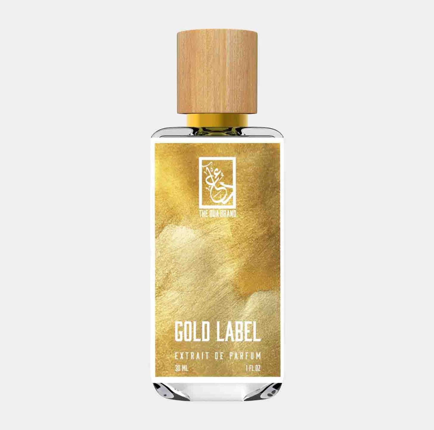 Dua Gold Label Sample is een luxe parfum in een elegante fles van 30 ml, met een opvallend gouden etiket en houten dop. Het design straalt verfijning en kwaliteit uit.