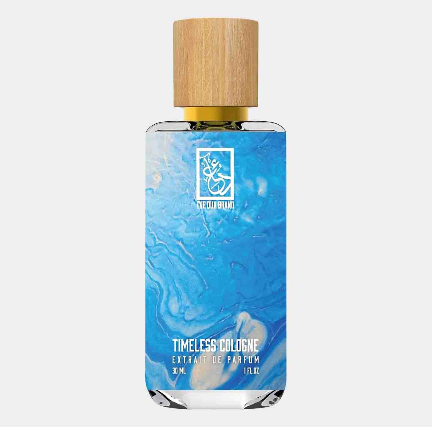 Dua Timeless Cologne in een stijlvolle glazen fles met een houten dop, gevuld met een blauwe vloeistof. De parfum is een extrait de parfum van 30 ml.