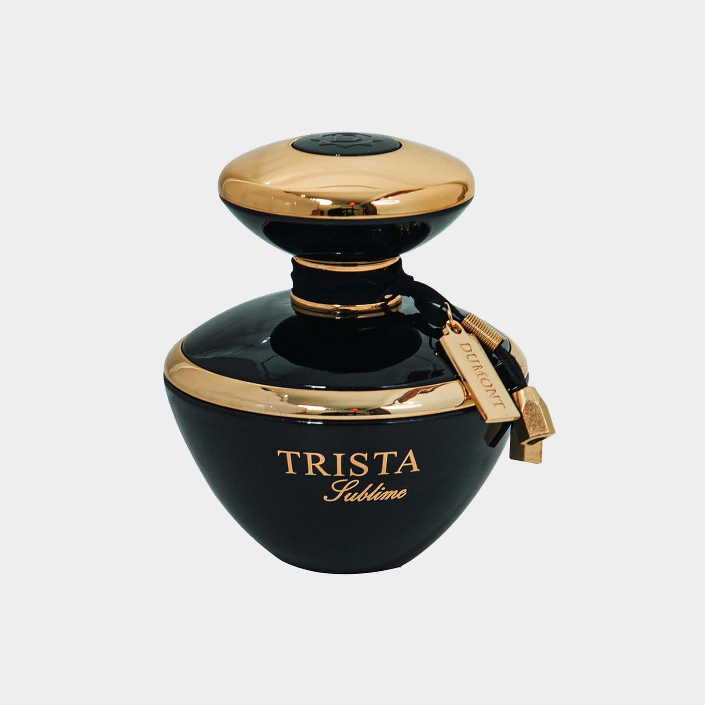 Trista Sublime Sample, een elegante parfumfles met een zwarte en gouden afwerking, perfect voor liefhebbers van verfijnde geur. De fles heeft een unieke, stijlvolle vorm en een lustrous uitstraling.