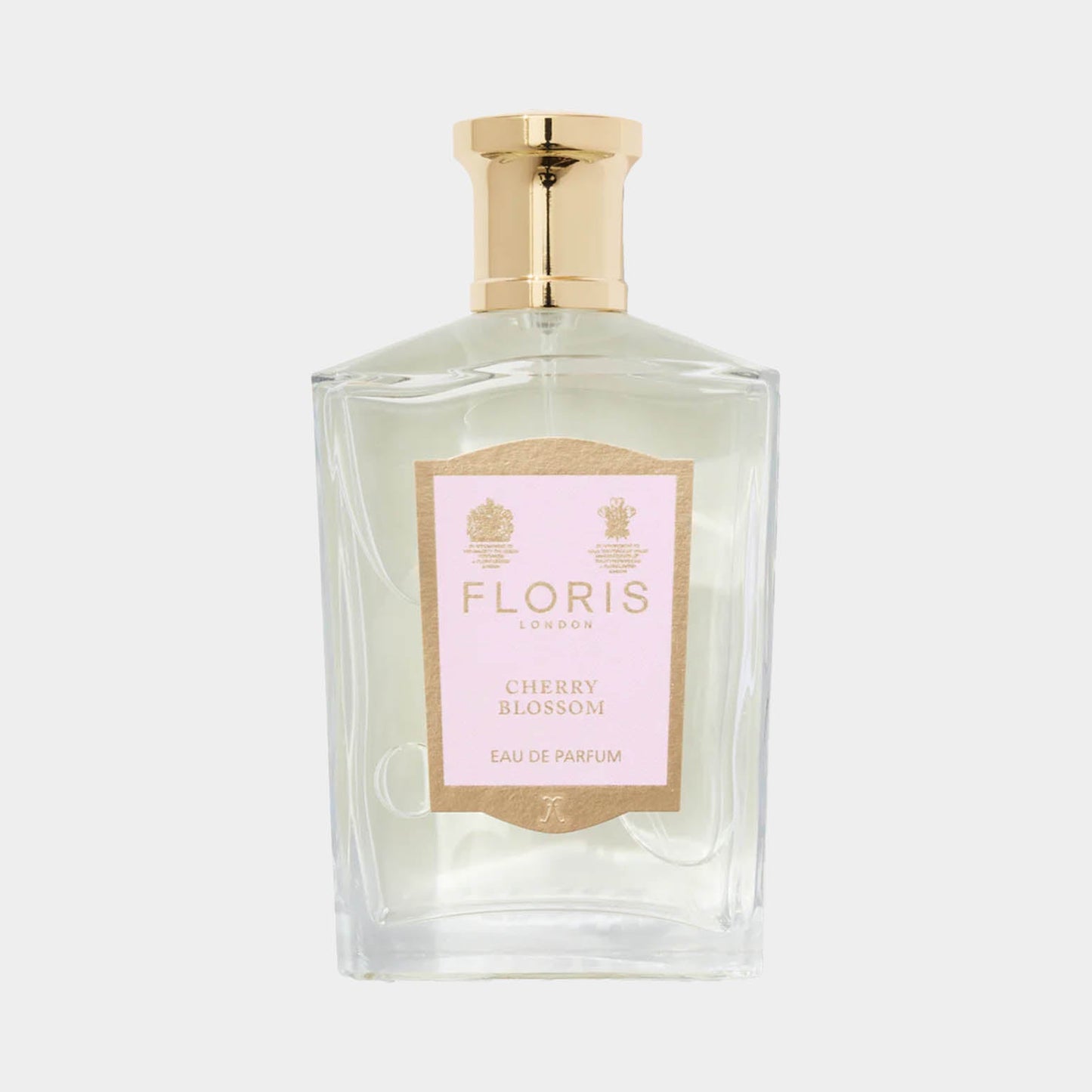 Floris London Cherry Blossom Sample, een elegant parfum in een transparante fles met een gouden dop en een roze etikettering. Dit parfum straalt de delicate geur van kersenbloesem uit.