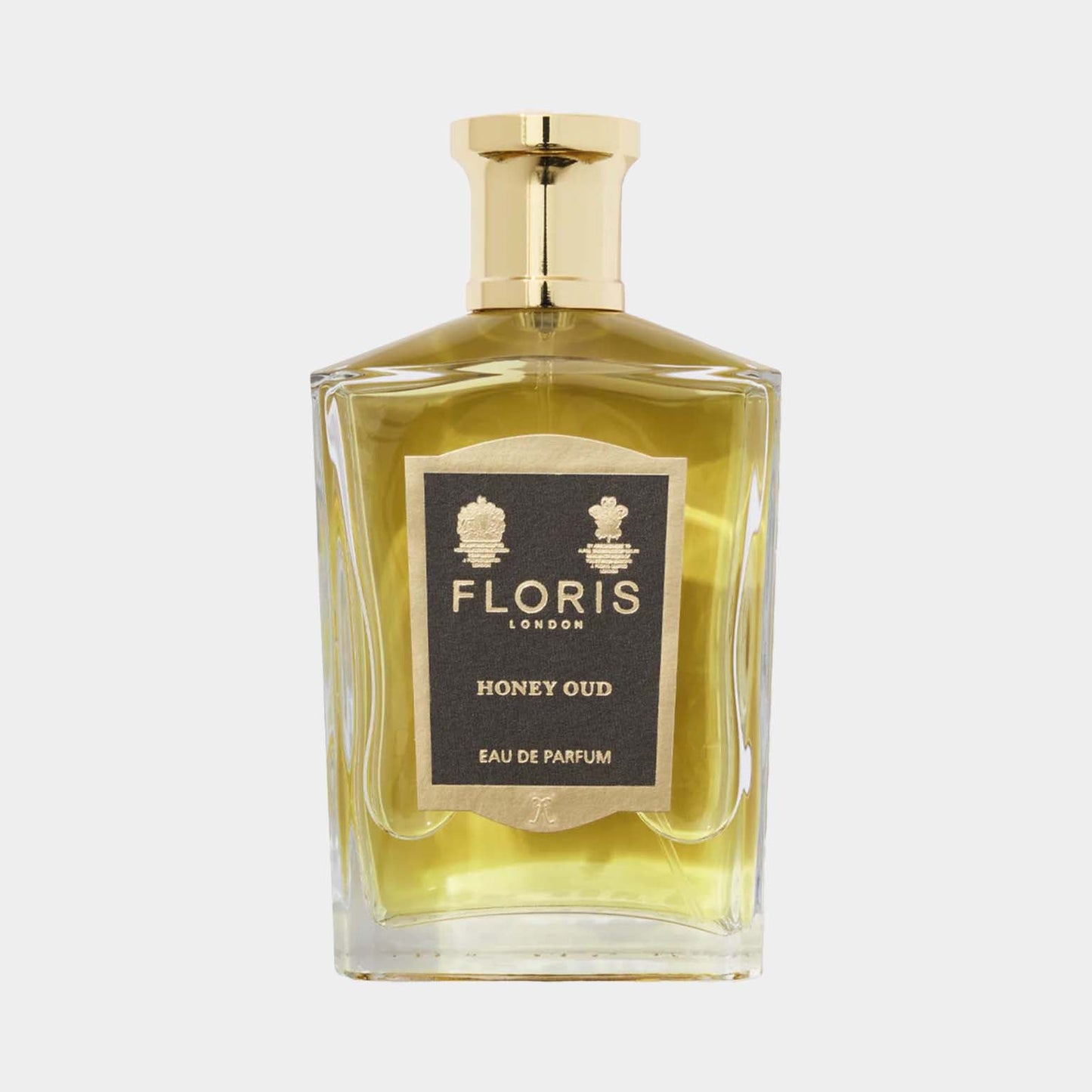 Floris London Honey Oud Eau de Parfum in een elegante, vierkante glazen fles met een gouden dop. De geur heeft een rijke mix van honing en houtachtige noten.