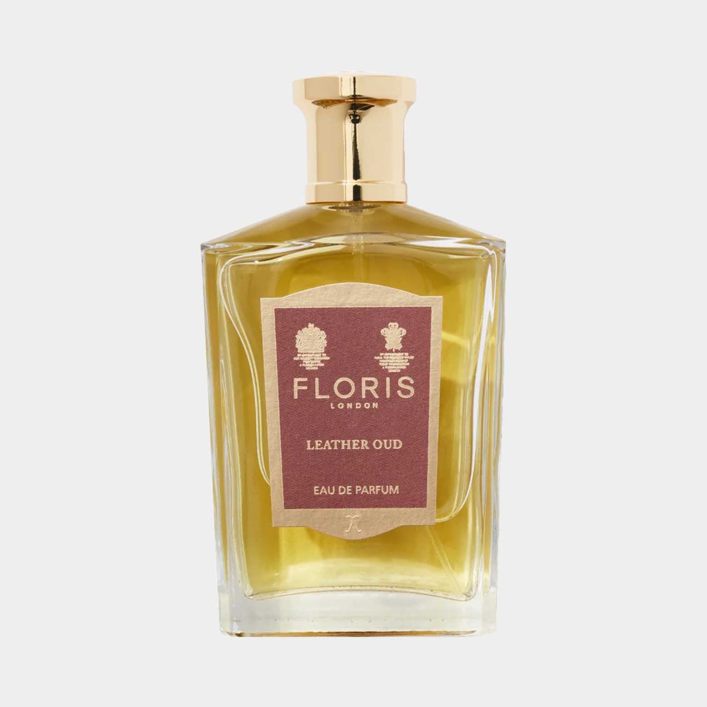Floris London Leather Oud Sample, een luxe eau de parfum in een elegant flacon met een gouden dop, uitgerust met een verfijnd label.