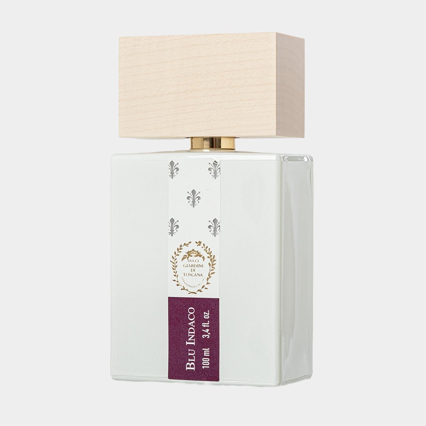 Giardini di Toscana Blu Indaco Sample, een elegant parfumflesje in een strakke, witte verpakking met een houten dop en een opvallend etiket.