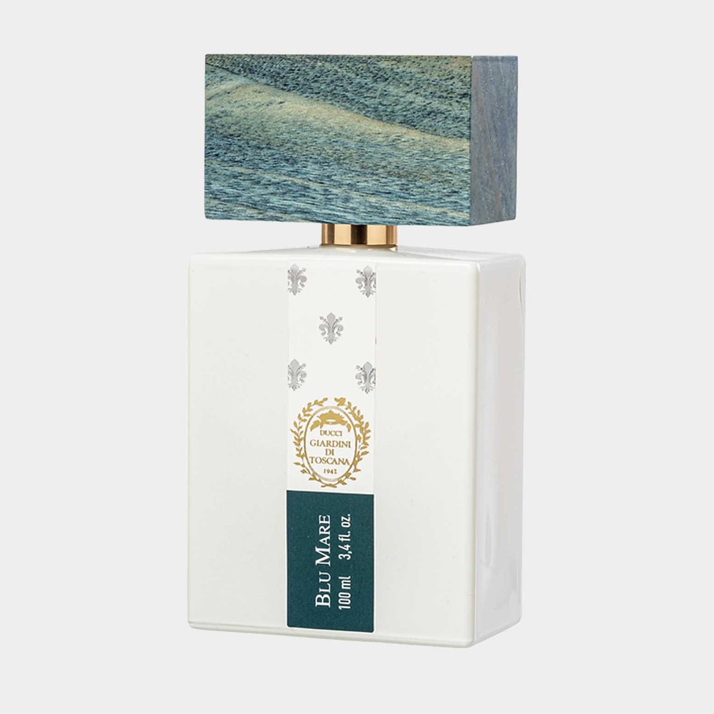 Giardini di Toscana Blu Mare Sample, een elegante parfumfles met een witte basis en een unieke, golfachtige dop. Het ontwerp straalt een gevoel van verfijning en frisheid uit.