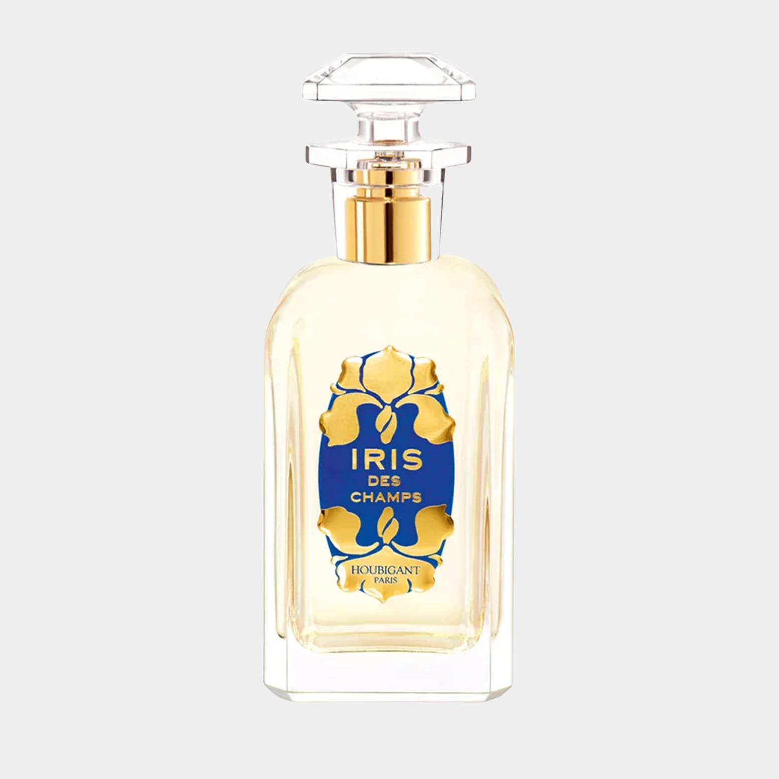 Een volle fles Houbigant Iris des Champs parfum, duidelijk zichtbaar met een elegante glazen fles en een opvallend blauw etiket met gouden details.