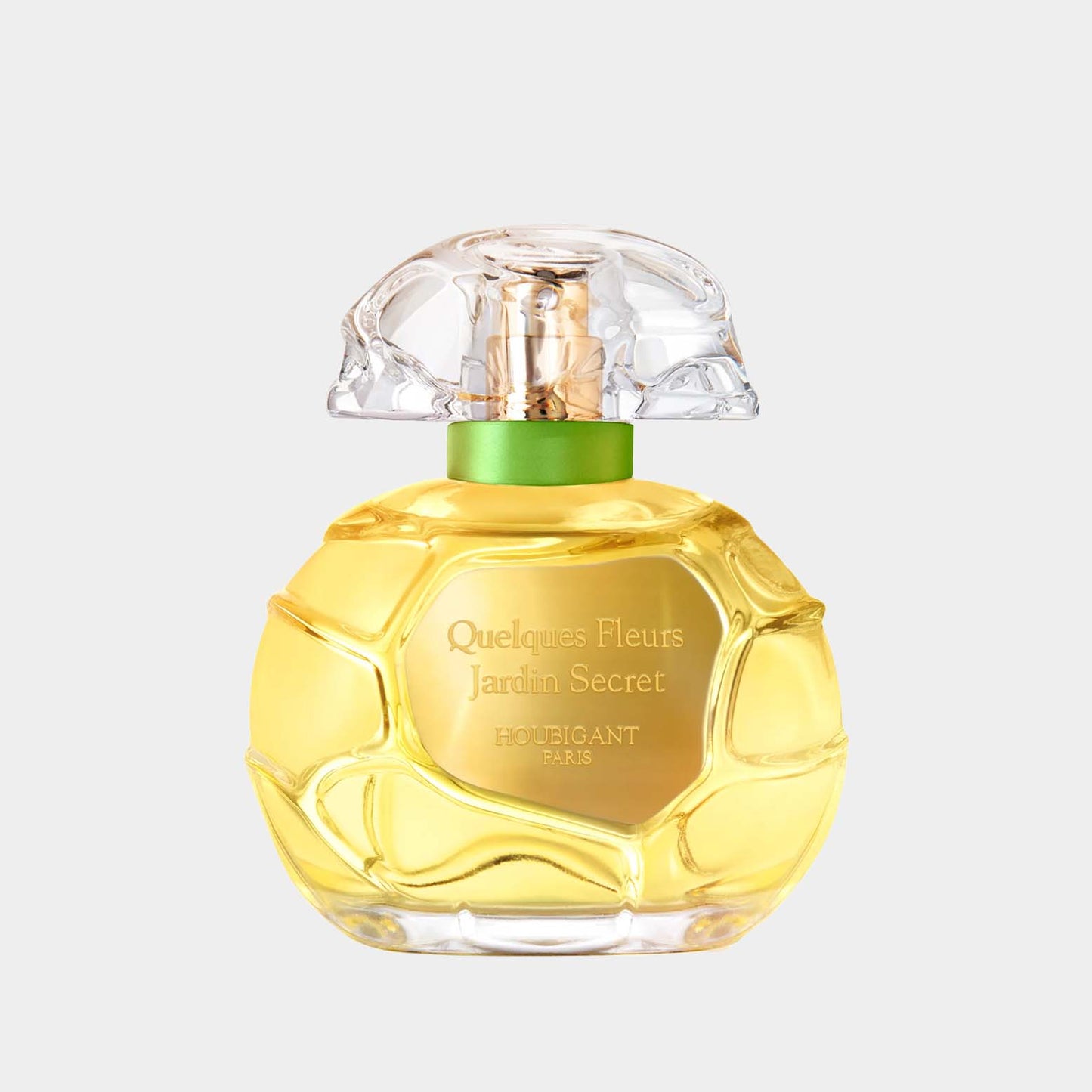 Houbigant Quelques Fleurs Jardin Secret Sample, een elegant parfumflesje met een unieke, gegraveerde groene dop en een heldere, gouden vloeistof.