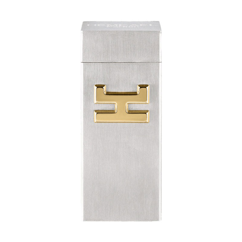 Hemcael Horruit Sample in een strak, zilverkleurig doosje met een gouden logo. Het ontwerp is modern en elegant.