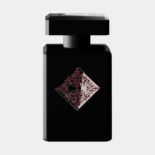 Initio Addictive Vibration Sample in een elegant zwart flesje met een opvallend rood en zilver motief op de voorkant.