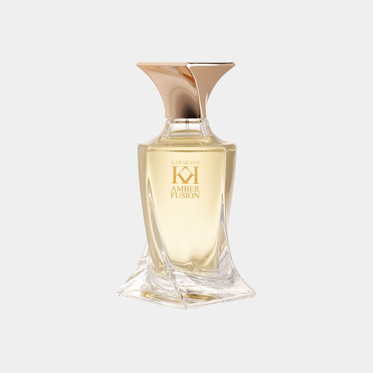 Karakash Amber Fusion Sample, een verfijnde parfumflacon met een elegante, moderne vorm en een gouden dop, bevat een luxueuze ambergeur.
