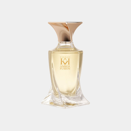 Karakash Amber Fusion Sample, een verfijnde parfumflacon met een elegante, moderne vorm en een gouden dop, bevat een luxueuze ambergeur.