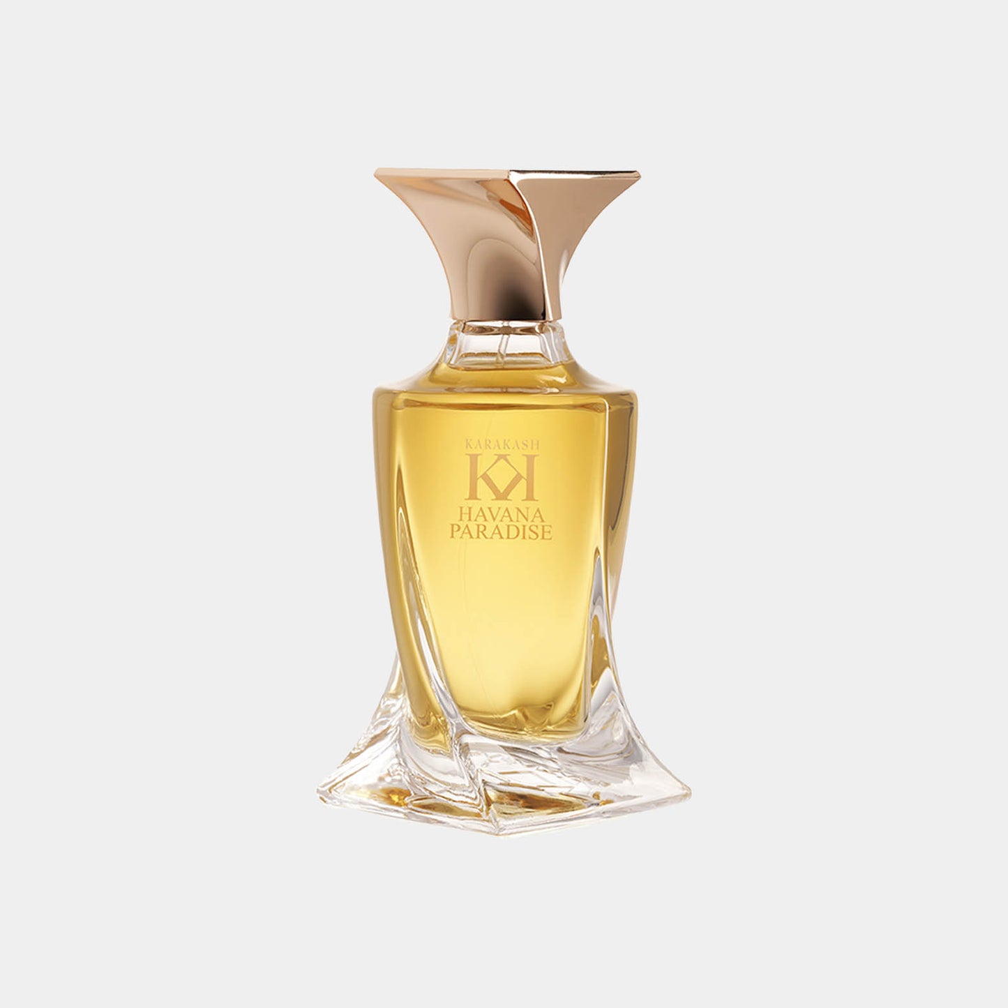 Een elegante parfumfles van Karakash met de naam Havana Paradise Sample, gevuld met een gouden geur. De fles heeft een stijlvolle, moderne vorm en glanzende afwerking.
