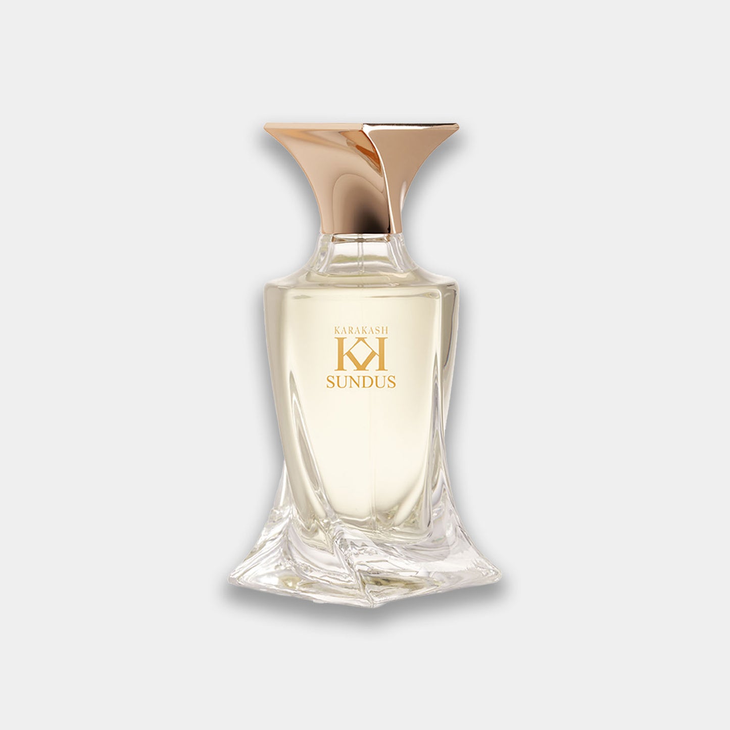 Karakash Sundus Sample is een elegante parfumfles met een unieke, moderne vorm en een gouden dop, gevuld met een helder vloeistof.
