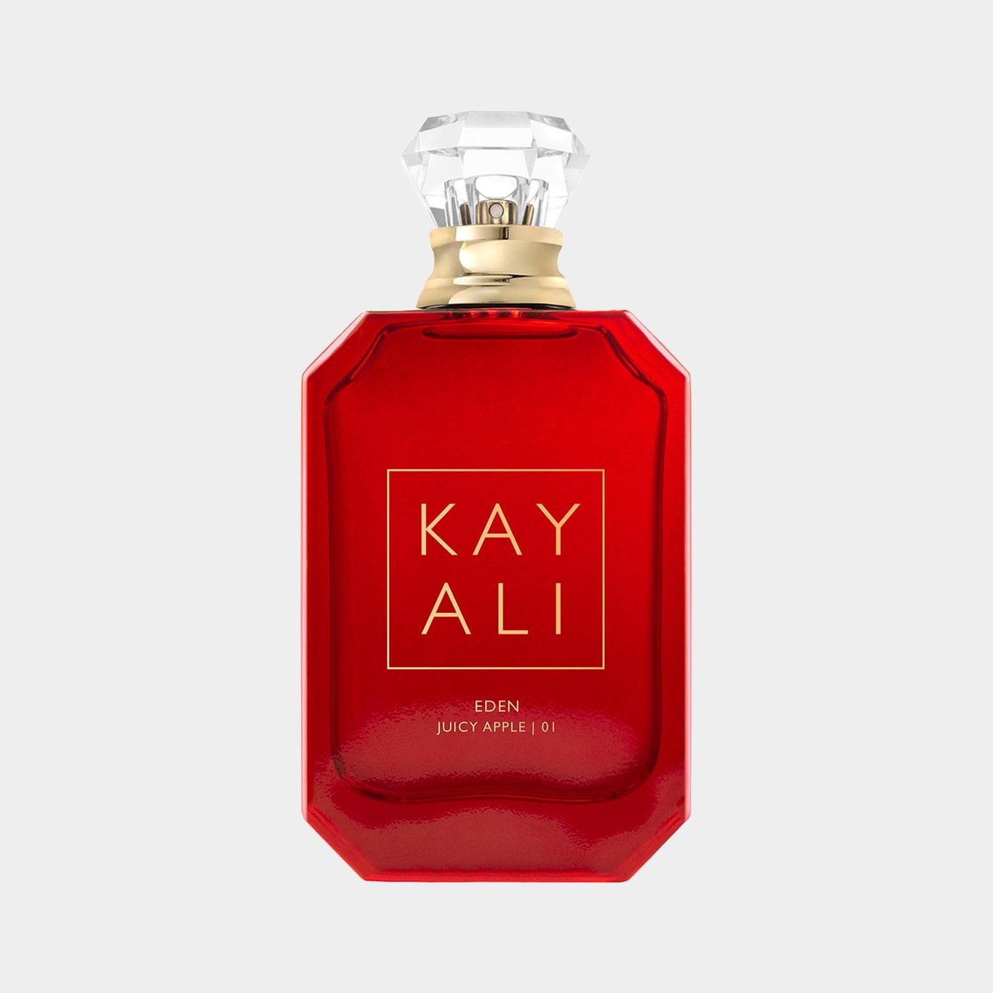 Kayali Eden Juicy Apple 01 monsterfles met een luxe, glanzende rode verpakking en een decoratieve dop. Dit parfum belooft een fruitige en verfrissende geurervaring.