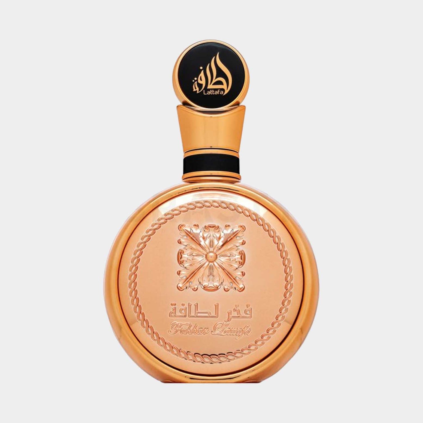 Lattafa Fakhar Gold Sample - Een luxe parfumflacon met een gouden afwerking en een iconische, gedetailleerde dop.
