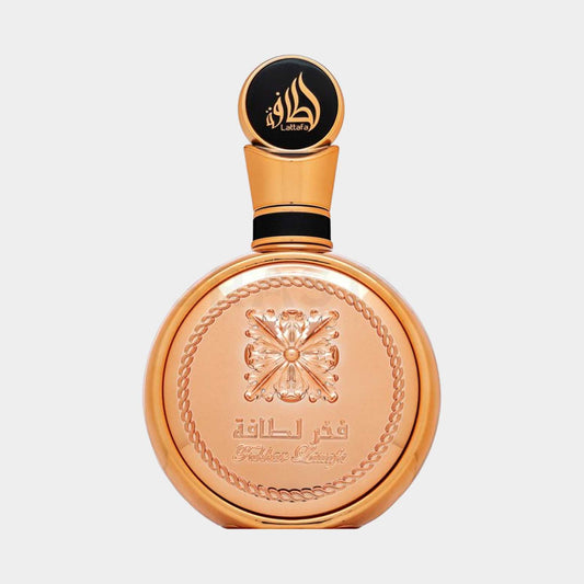 Lattafa Fakhar Gold Sample - Een luxe parfumflacon met een gouden afwerking en een iconische, gedetailleerde dop.