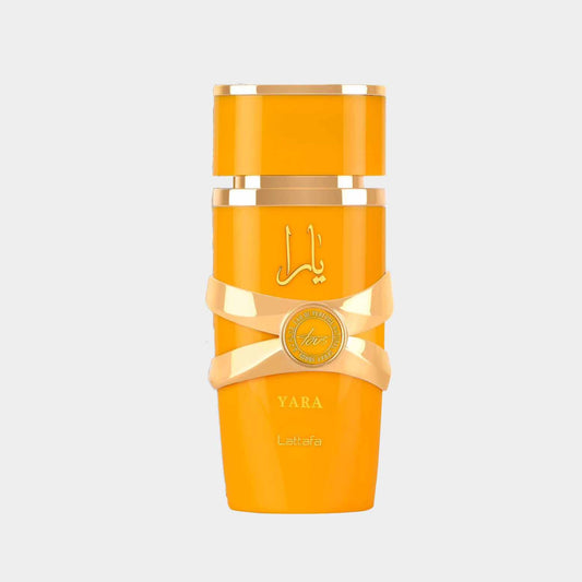 Volledige fles Lattafa Yara Tous parfum in een stralende gele verpakking met een elegante strik, perfect voor elke gelegenheid.