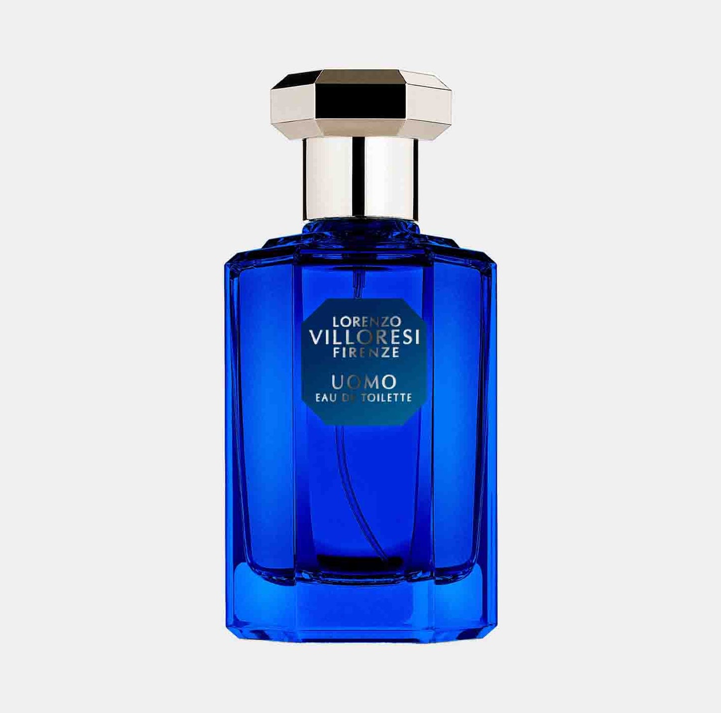 Fles van Lorenzo Villoresi Uomo EDT, een elegante, kleurrijke parfumfles in diepblauw met een stijlvolle, zilveren dop.