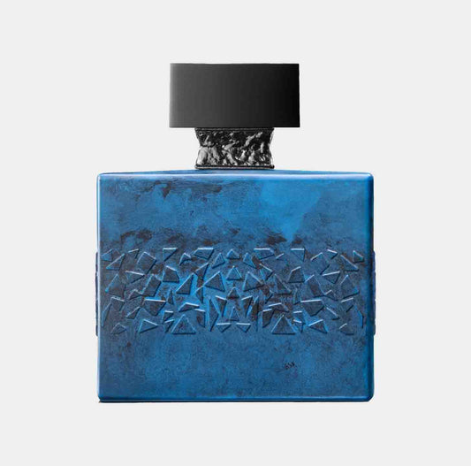 M. Micallef DesirToxic Sample - een stijlvolle, turquoise geurflacon met een uniek, geometrisch patroon en zwart deksel.