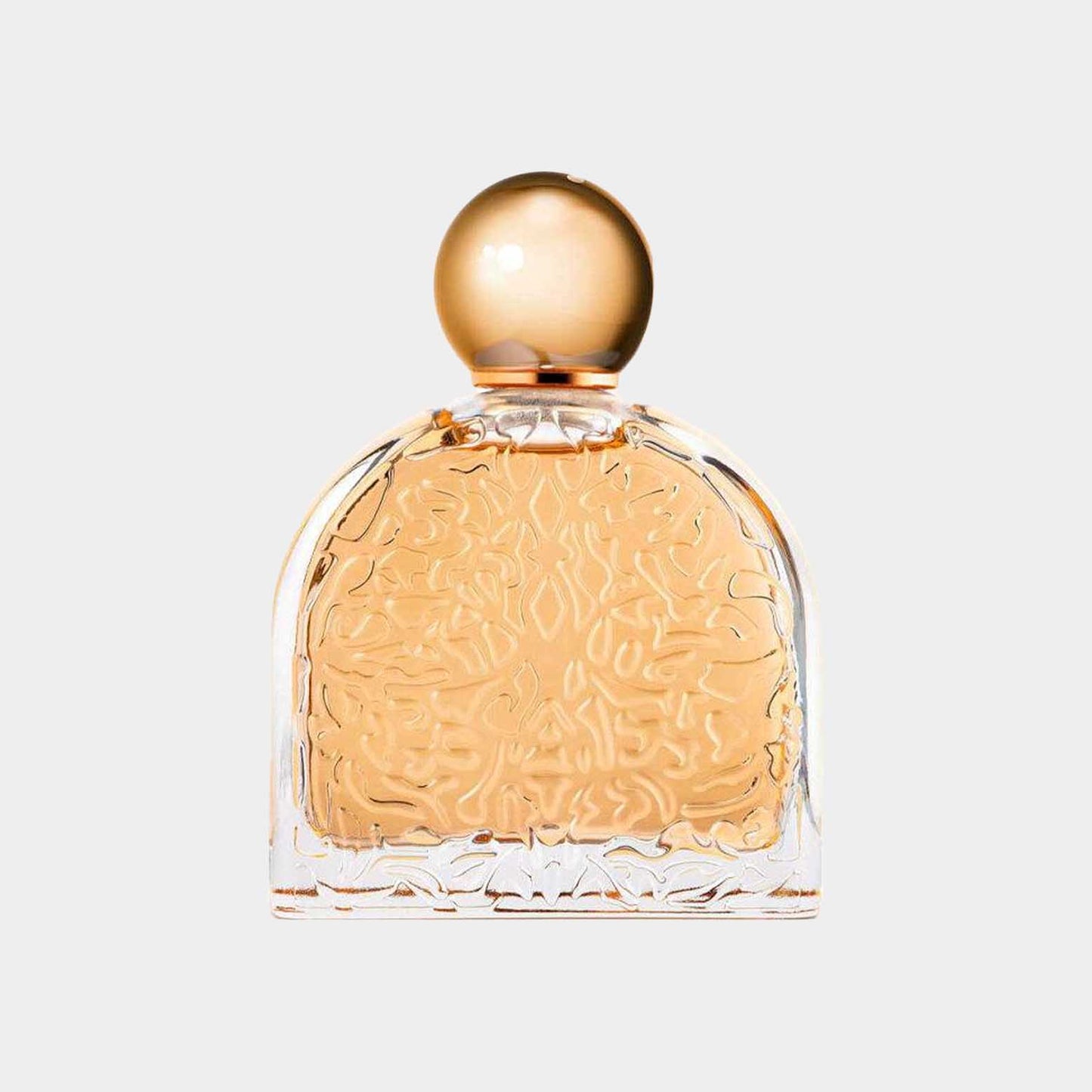 M. Micallef Ô Féminin Sample: Een elegant parfumflesje met een gouden dop en een delicate, gegraveerde vorm.