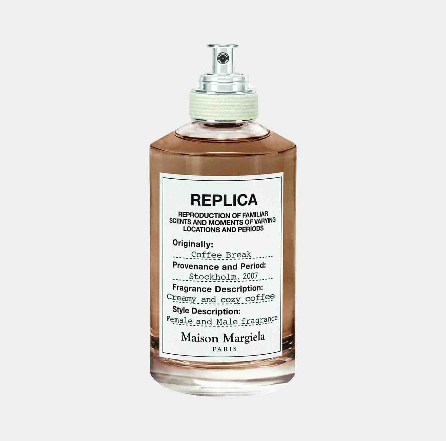 Maison Martin Margiela Replica Coffee Break Sample is a stylish fragrance bottle featuring a label that describes its scent as creamy and cozy coffee, evoking a warm moment in Stockholm, 2007.