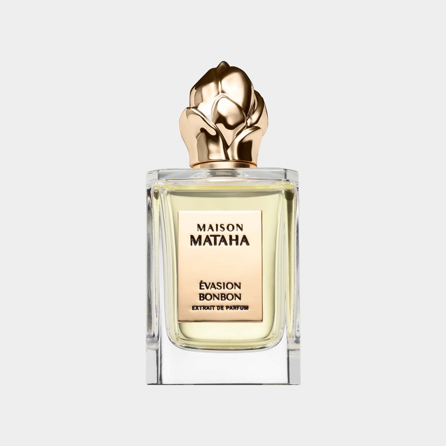 Maison Mataha Évasion Bonbon Sample, een elegante parfumfles met een goudkleurige dop in de vorm van een bloem, waarin een zoete en verfijnde geur is gevangen.