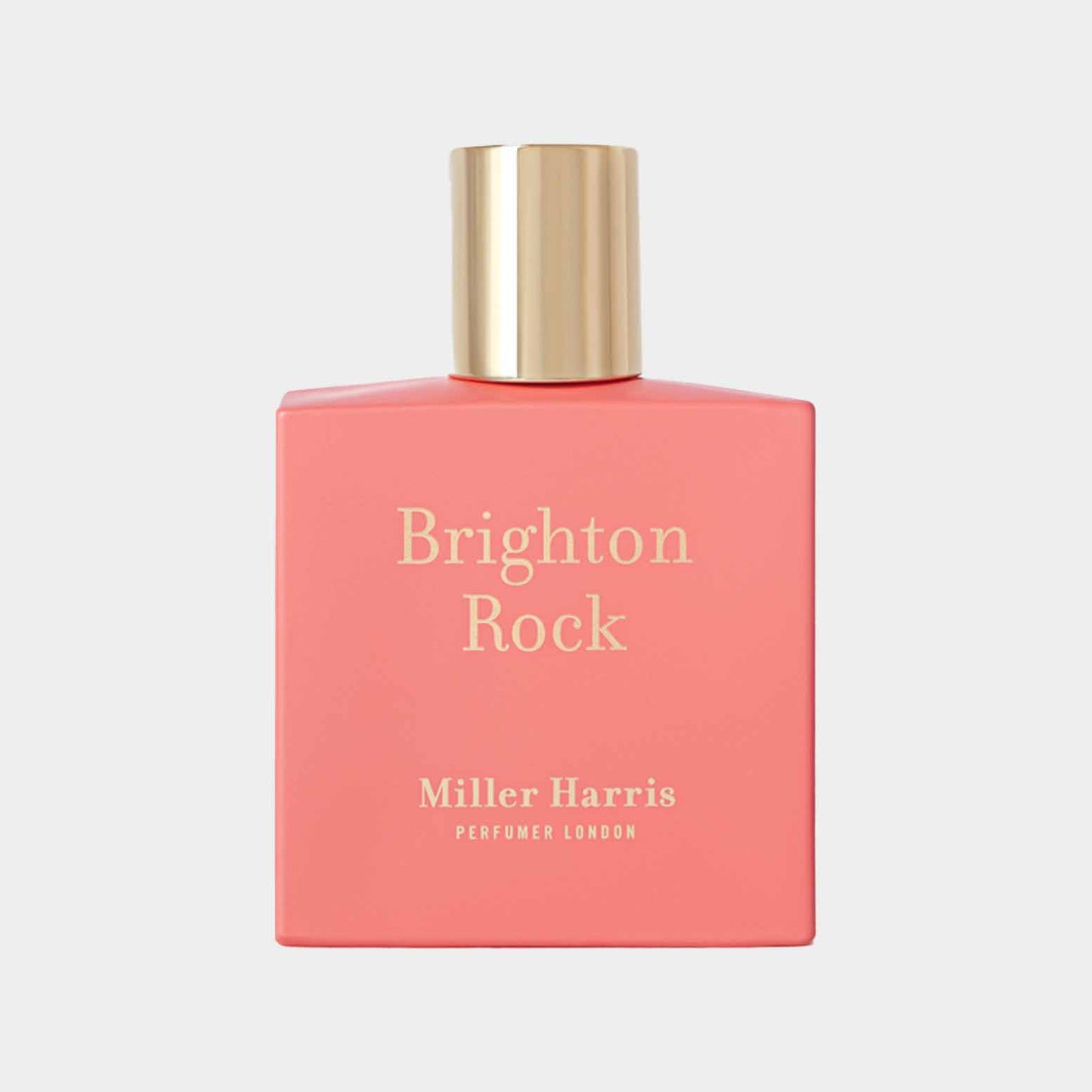 Monster van Miller Harris Brighton Rock, een geur in een kleurrijke roze fles met een elegante gouden dop, perfect voor een frisse, fruitige ervaring.