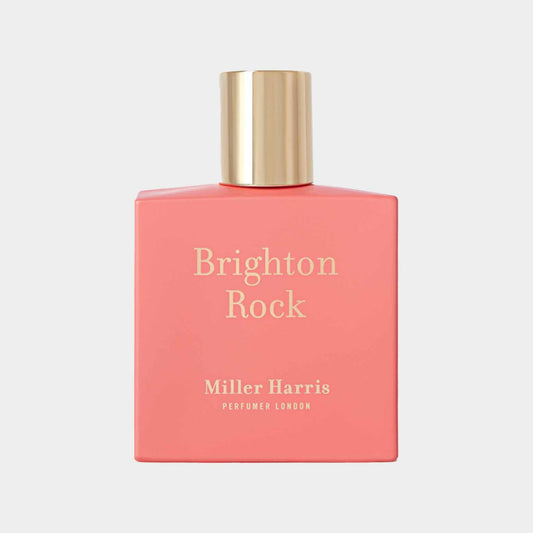 Monster van Miller Harris Brighton Rock, een geur in een kleurrijke roze fles met een elegante gouden dop, perfect voor een frisse, fruitige ervaring.