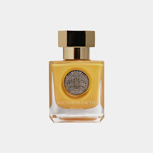 Nectar Olfactif Melipona Sample in een elegante geurflacon met een gouden dop en een decoratieve label in het midden.