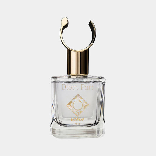 Noème Paris Divin Part Sample, een elegante parfumfles met een gouden dop en een minimalistisch ontwerp.