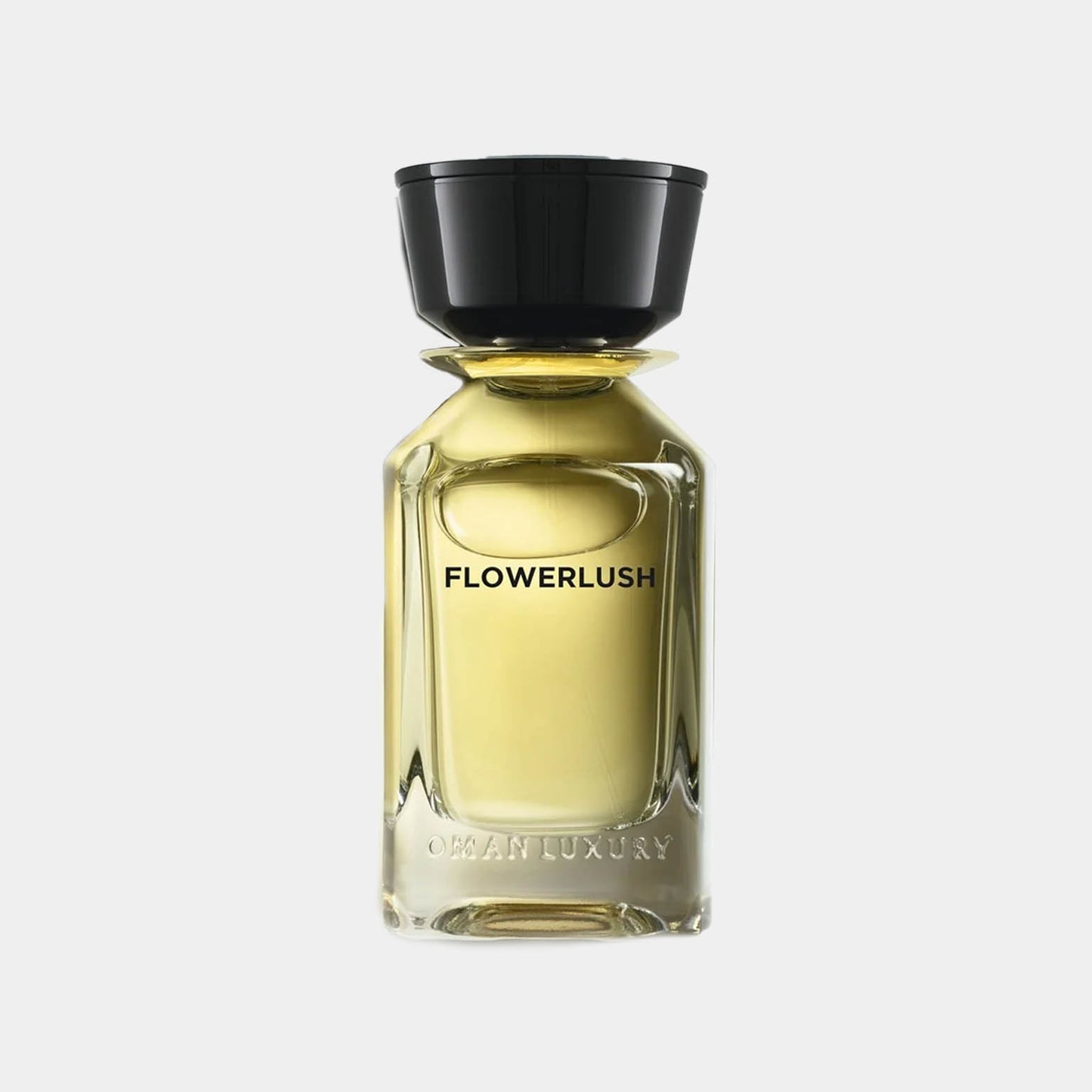 Omanluxury Flowerlush Sample, een elegant parfum met een verfijnde glazen fles en een zwarte dop, perfect voor de bloemige geurenset.
