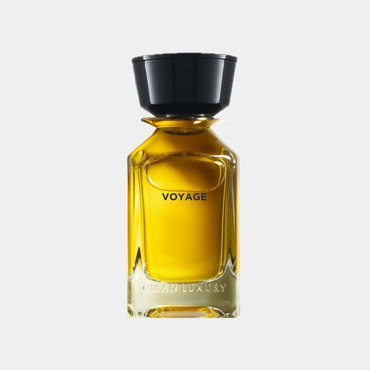 Fles van de Omanluxury Voyage Sample, een luxe geur met een elegant ontwerp en een opvallende gele vloeistof.