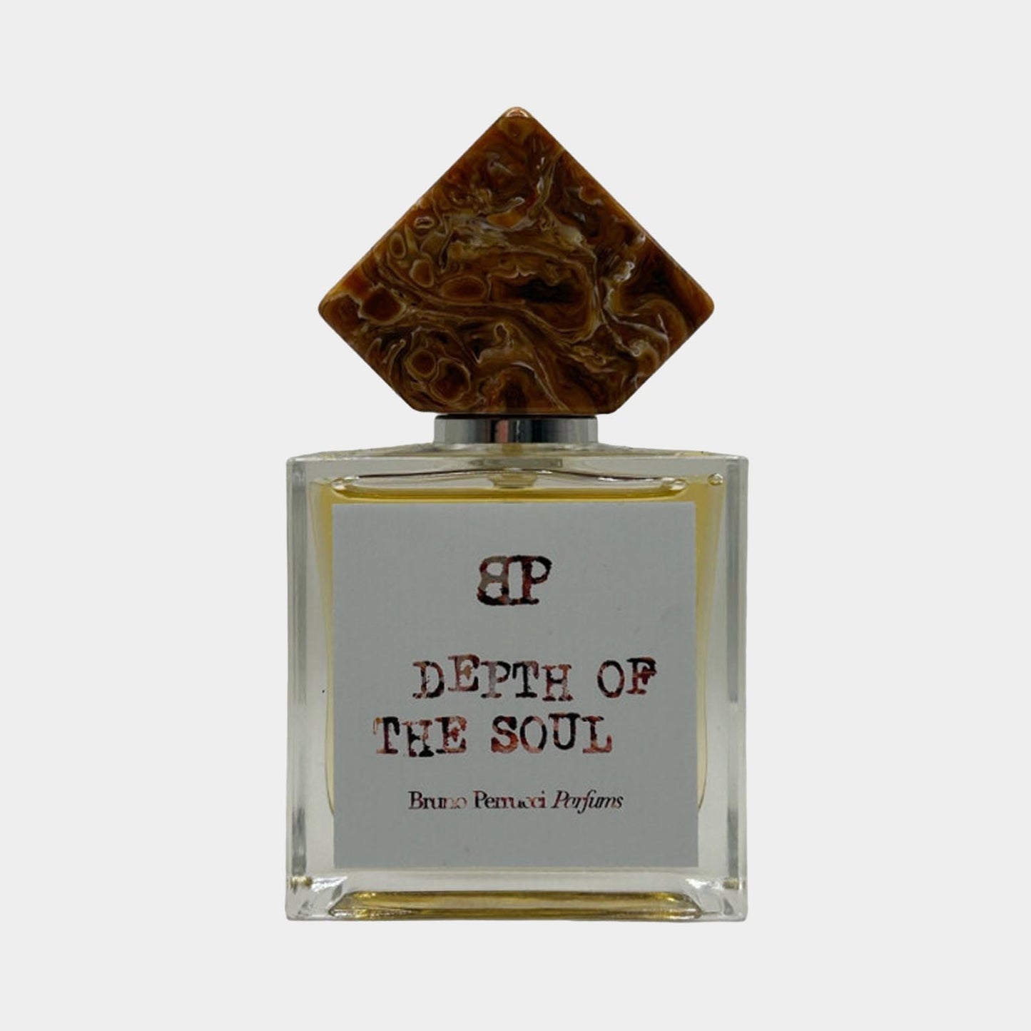 Bruno Perrucci Depth of Soul Sample, een luxueuze parfumfles met een unieke, decoratieve dop en een eenvoudig, elegant etiket.