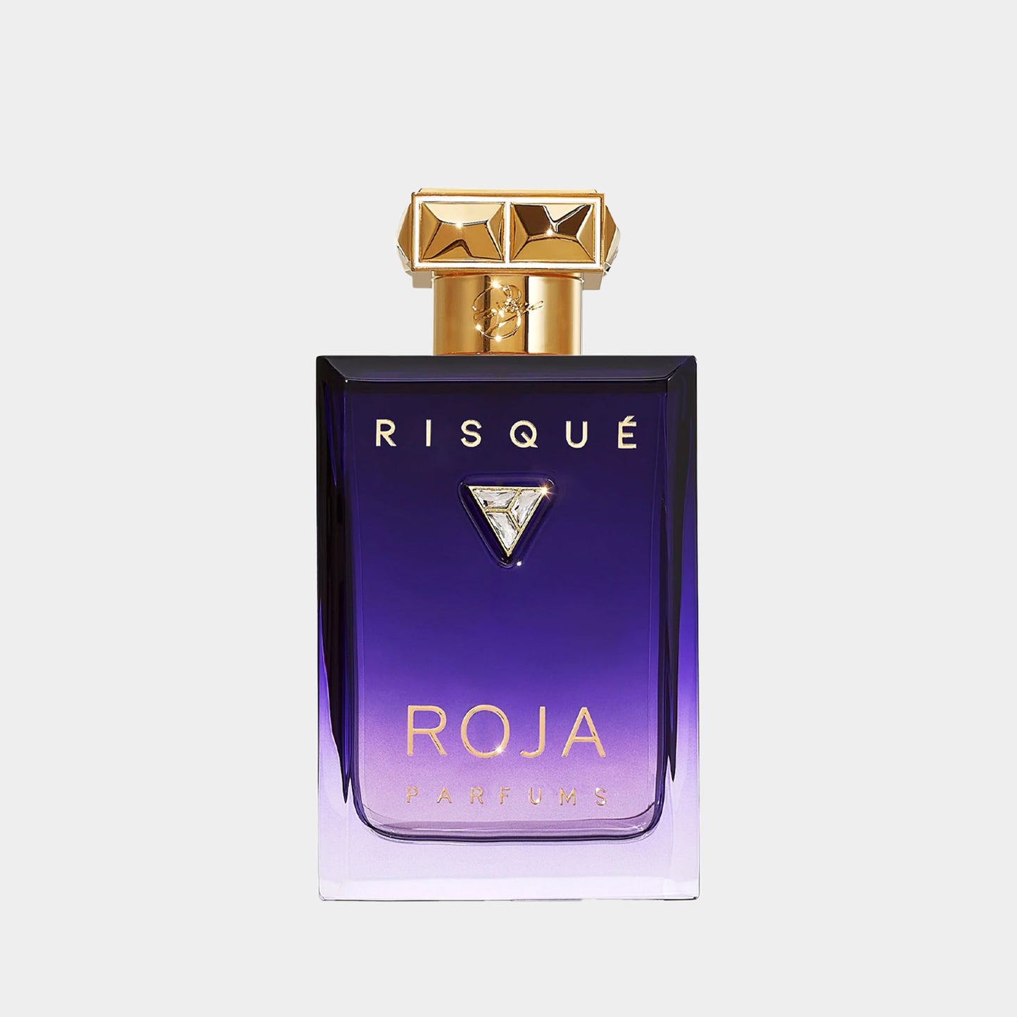 Sample van de Roja Dove Risque Pour Femme Essence De Parfum, verpakt in een chic, paarse fles met gouden accenten en een unieke diamantvormige dop. Een luxe geurervaring in een compacte formule.