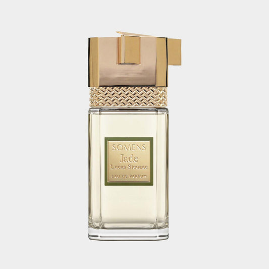 Somens Jade Sample is een elegant parfum met een luxueuze verpakking, voorzien van een gouden sluiting en een verfijnde geur. Het flesje staat stijlvol op een lichte achtergrond.