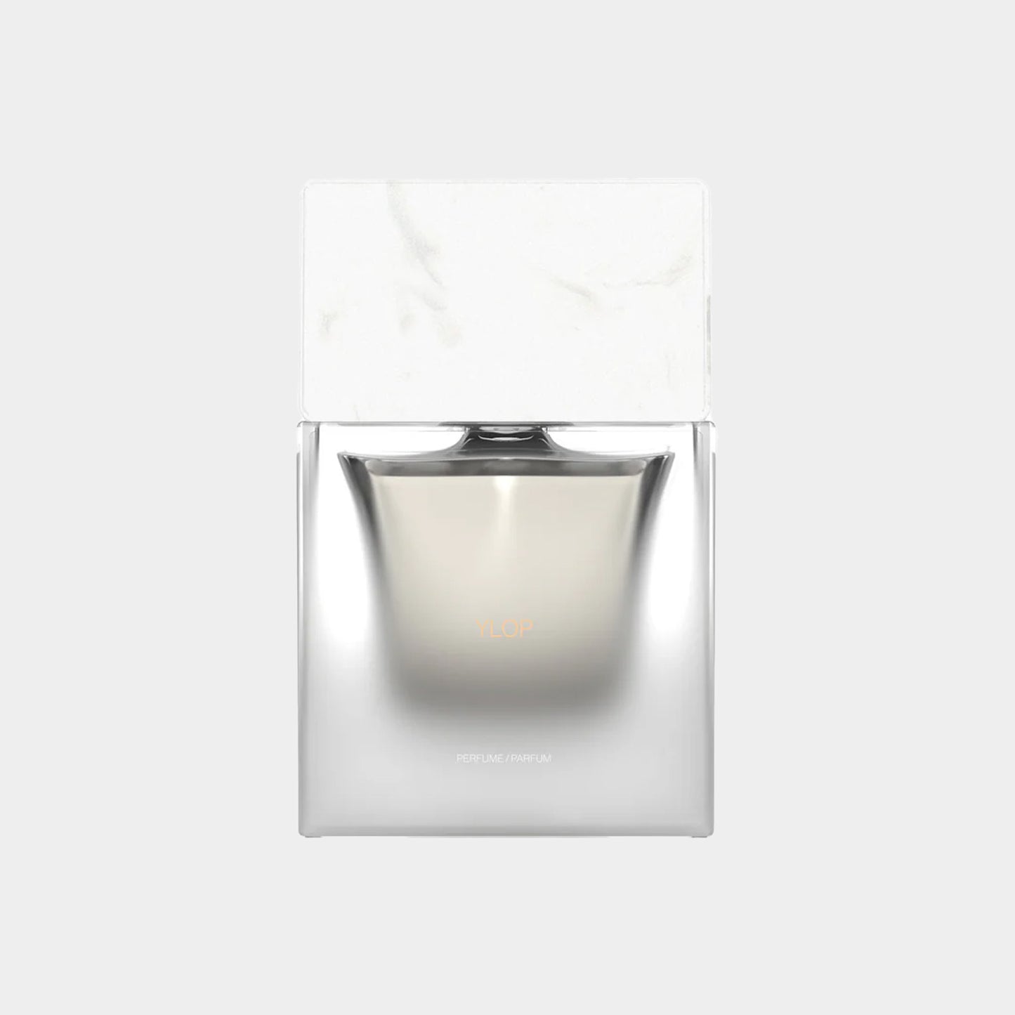 Sora Dora Ylop Sample, een elegante parfumfles met een strakke, moderne vorm en een marmeren dop.