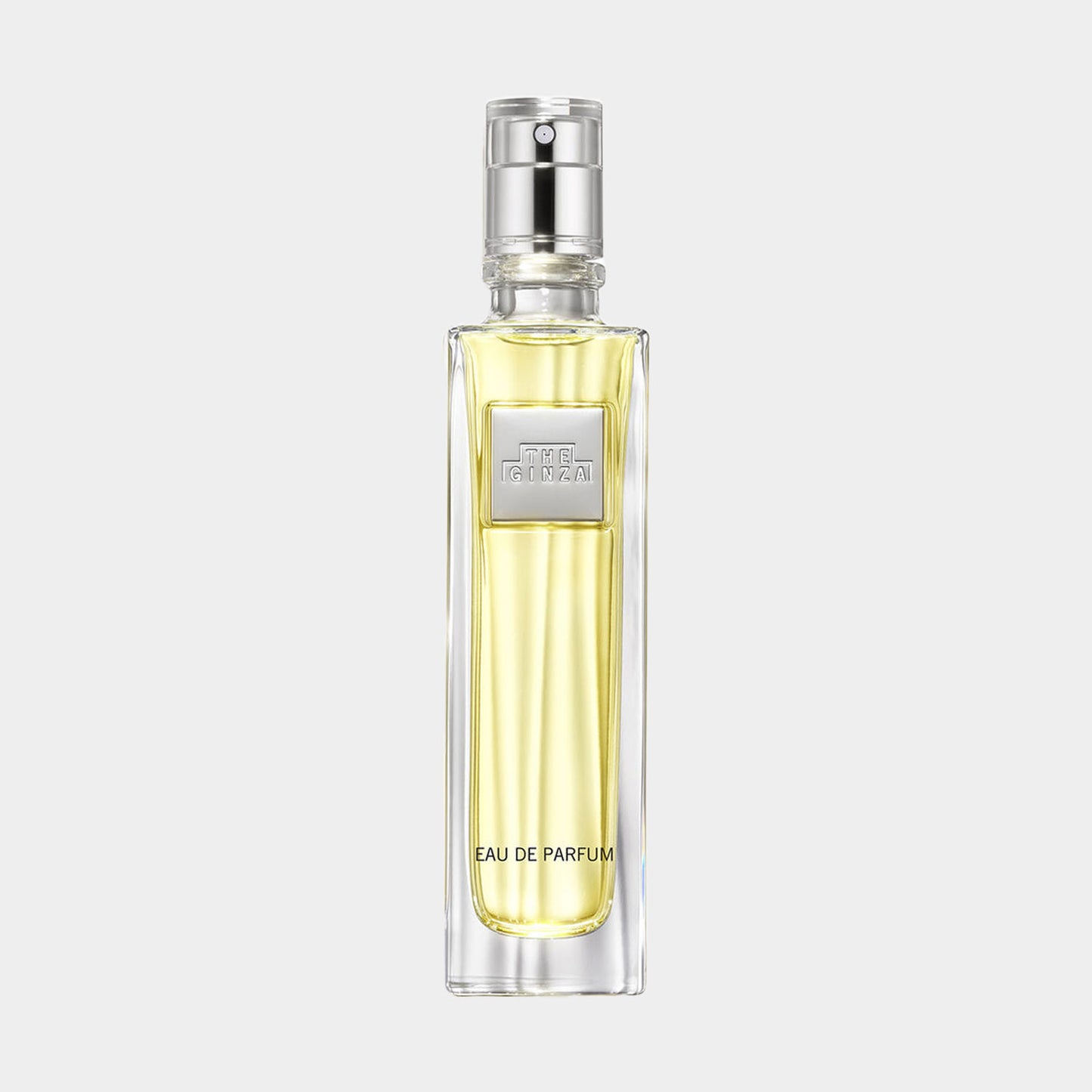 De Ginza EDP Sample in een elegant transparant flesje, met een gouden vloeistof en een zilveren spuitmondje.