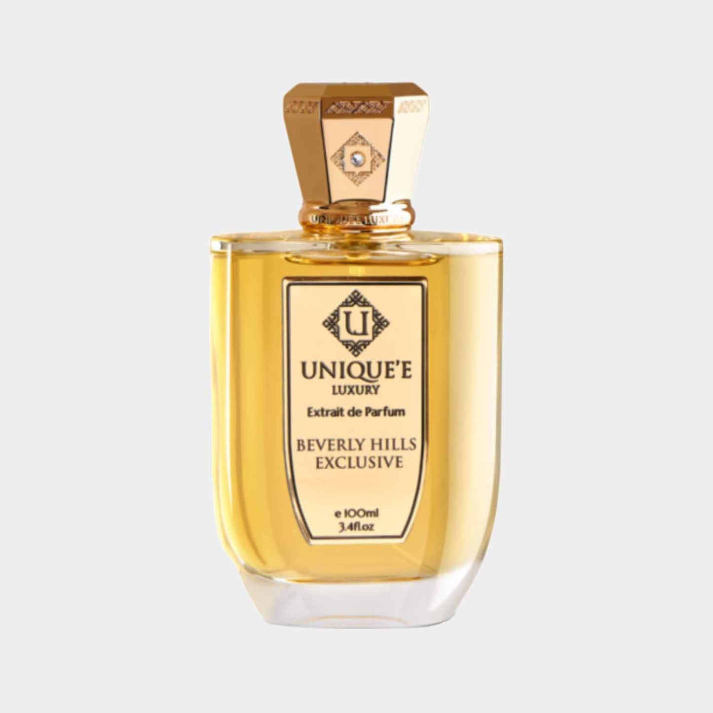 Uniquee Luxury Beverly Hills Exclusive Sample is een elegante parfumfles met een gouden vloeistof en een luxe, gedetailleerde dop, perfect voor fijnproevers van exclusieve geuren.