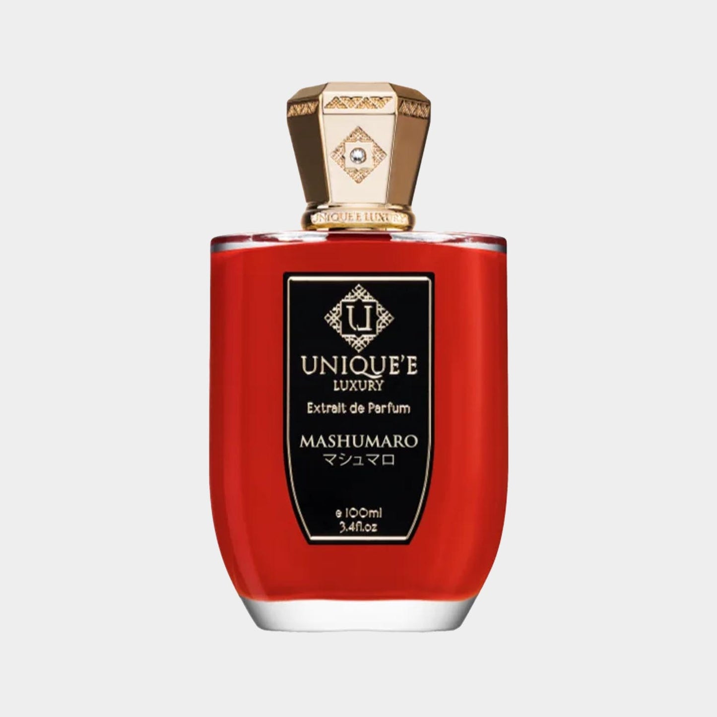 Een fles Uniquee Luxury Mashumaro Sample, met een opvallende rode vloeistof en een elegant gouden goedgekeurd deksel, perfect voor parfumliefhebbers.
