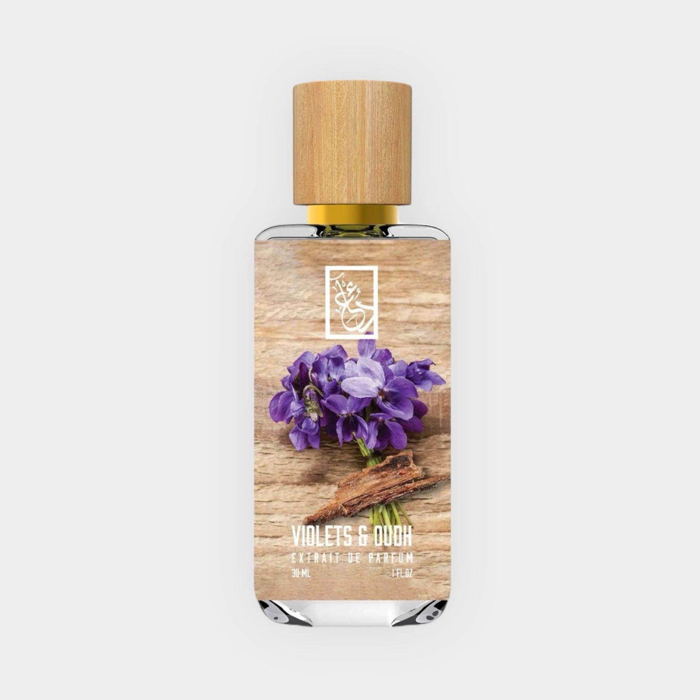 Een sample van Dua Violets & Oudh, gepresenteerd in een elegante fles met een houten dop, verfraaid met paarse viooltjes en houtaccenten.
